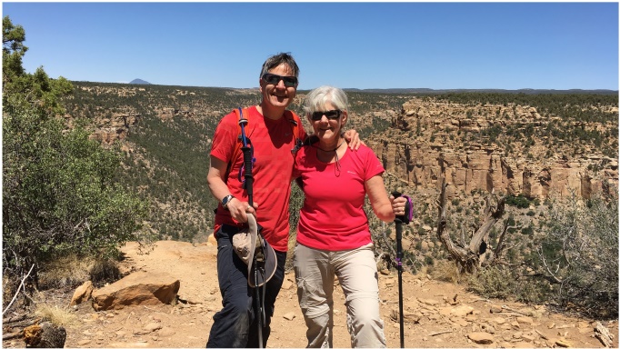 Pete and Nancy standing at the edge of a cliff at Mesa Verde National Park